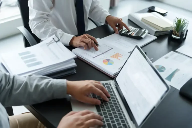 Business man analyzing data paperwork